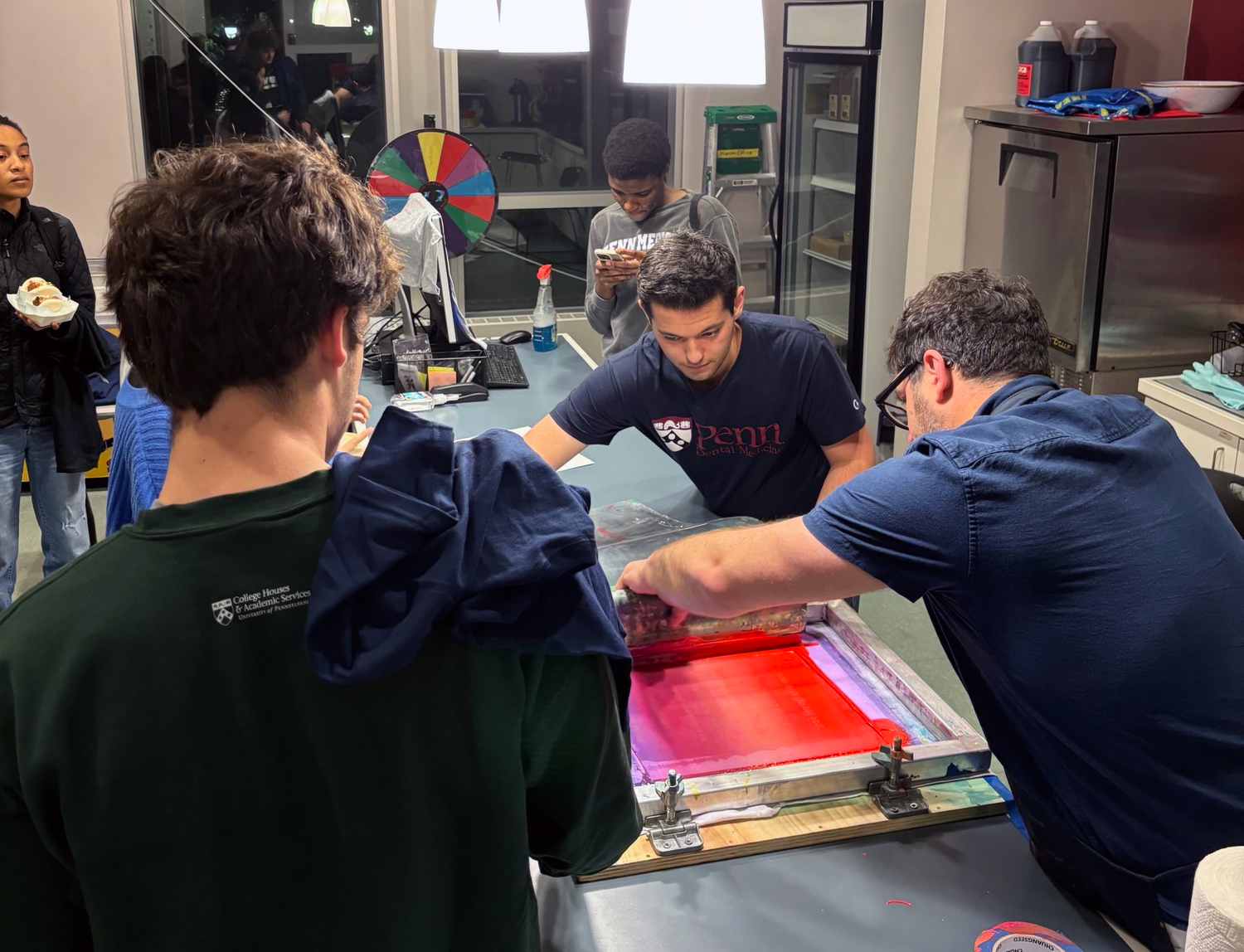 Harrison students silkscreen T-shirts with House Fellow Matt Neff